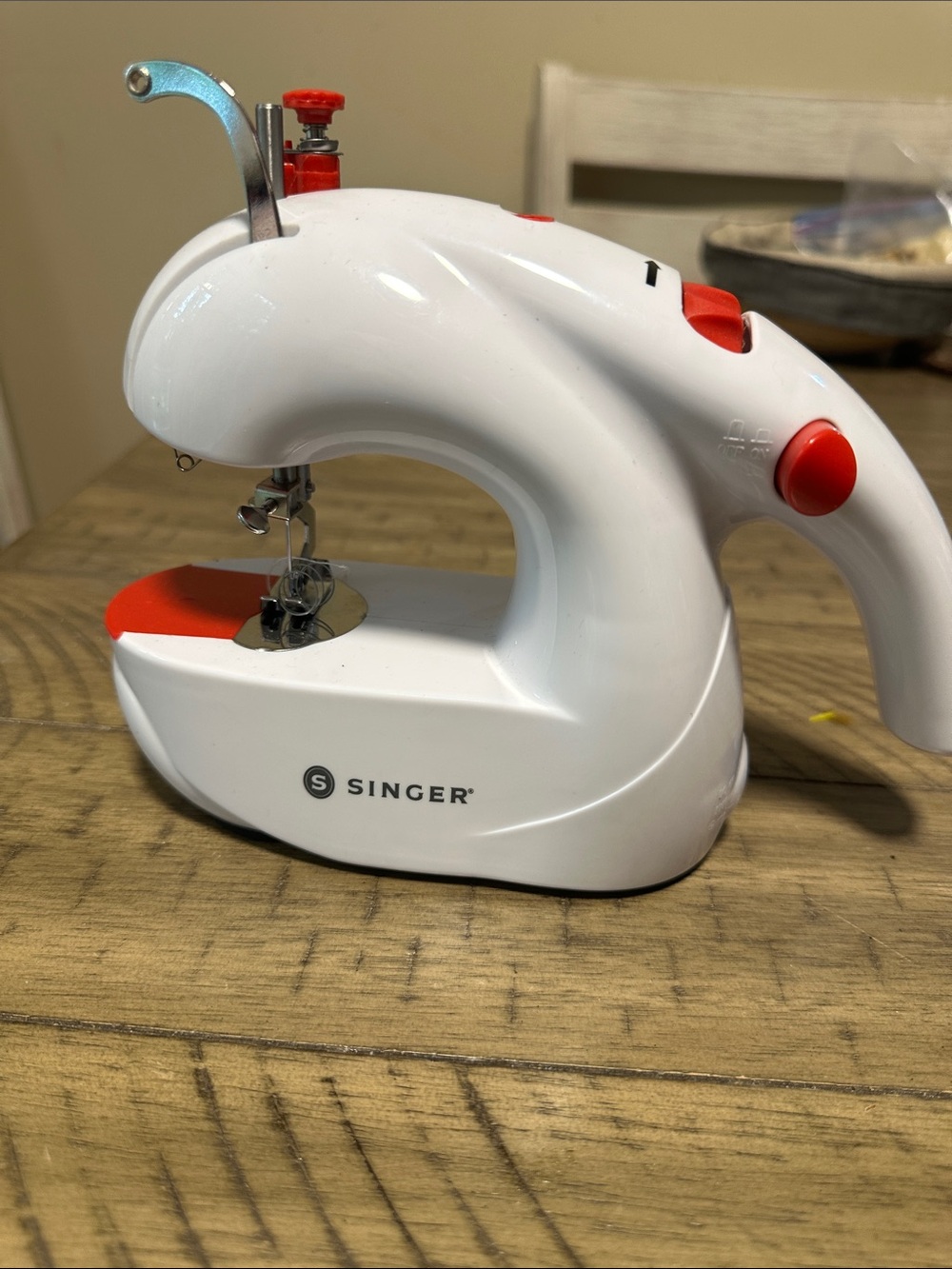 Singer Mini Handheld Sewing Machine in White and Red